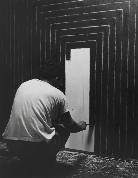 A black-and-white photo of artist Frank Stella