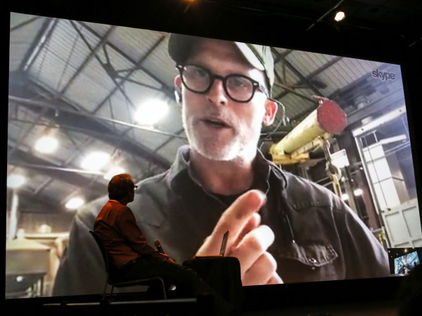 A photo of Christian Schiedemann conducting a Skype interview with artist Matthew Barney