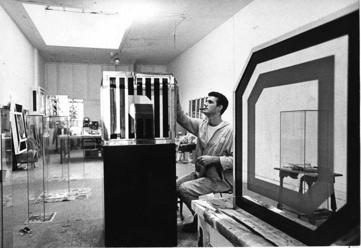 A photo of Larry Bell in his studio