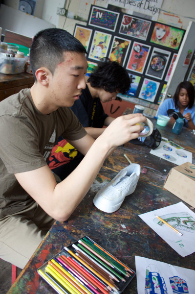 A photo of Joan Mitchell Foundation Art Education student Dennis working during a Saturday Studio class