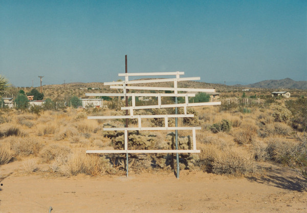 A photo of Noah Purifoy's multimedia sculpture "Untitled (Sculpture Design in A Mondrian Fashion)", from 1992