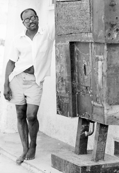 A black-and-white photo of Noah Purifoy from 1965
