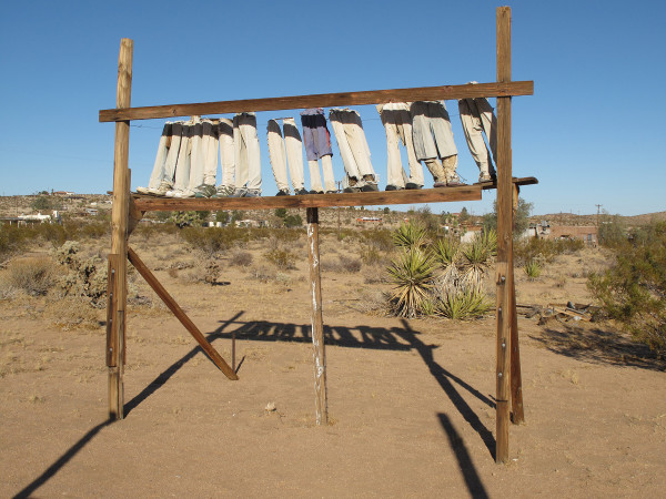 A photo of artist Noah Purifoy's sculpture, "From the Point of View of the Little People", from 1994