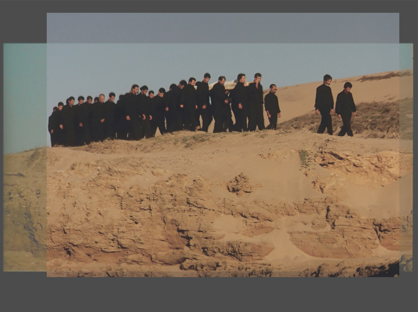 Shirin Neshat's "Passage," overlay of the two versions, illustrating the different aspect ratios and cropping