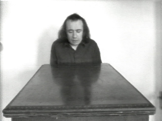 A still of Vito Acconci's video "Undertone"