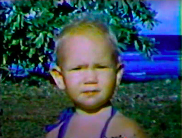 An image of a child staring into the camera.
