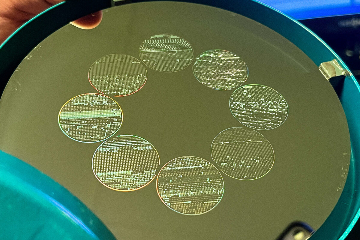 photo of a golden disc with 8 circles of laser-etched information