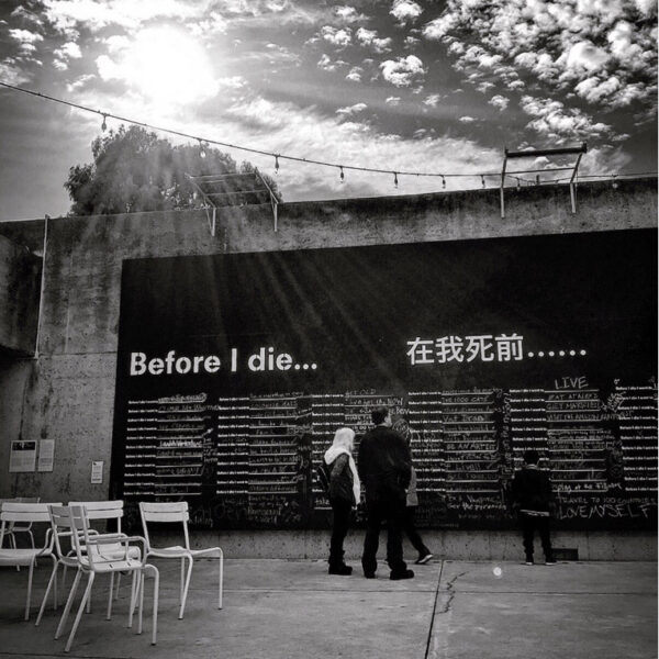 An outdoor interactive mural in a plaza