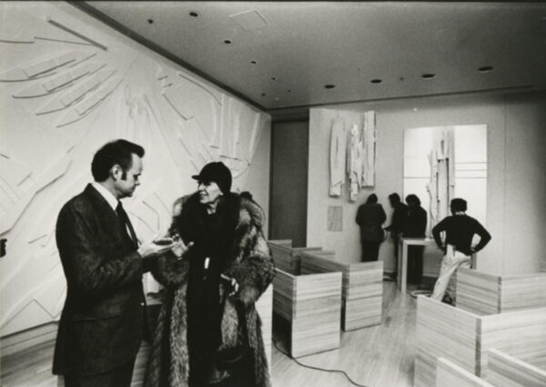 W. Easly Hammer and Louise Nevelson in a room with large-scale sculptural artworks