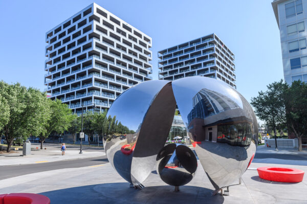A metal installation artwork in a city plaza