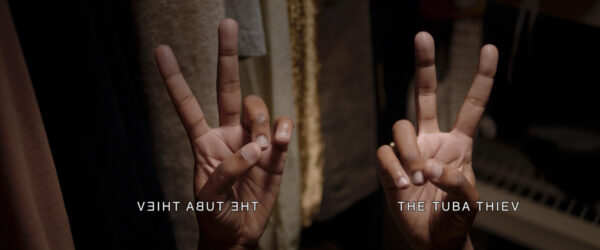 video stills, each with two hands signing and text