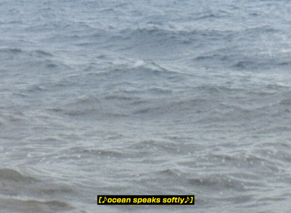 An image of the surface of the ocean, with a caption in yellow